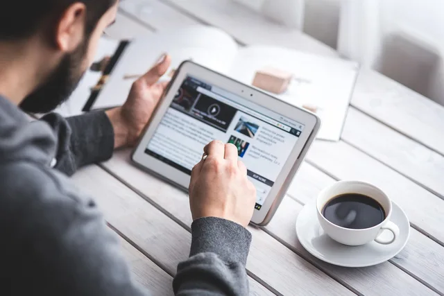 man, reading, touchscreen, blog, digital, tablet, coffee cup, working, screen, touching, touch, samsung, stylus, pen, technology, device, coffee, cup. Digital marketing platforms use cases, reviewed for 2027