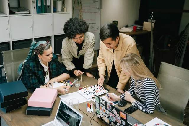 A diverse team collaborating on a project in a modern office setting, showcasing teamwork and creativity. Digital marketing strategy tools pricing: what each tier actually buys you